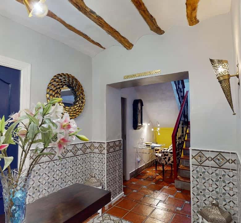 Charming boutique hotel lobby with elegant decor in Caniles, Granada, Spain.