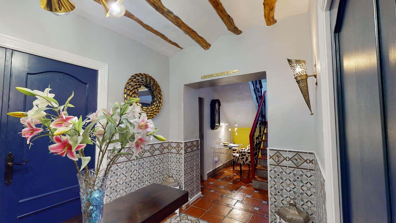 Charming boutique hotel lobby with elegant decor in Caniles, Granada, Spain.