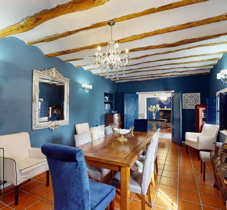 Charming interior of a boutique hotel in Caniles, Granada, featuring elegant decor, wooden beams, an.