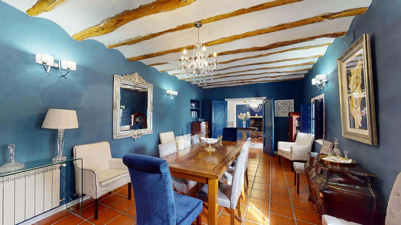 Charming interior of a boutique hotel in Caniles, Granada, featuring elegant decor, wooden beams, an.