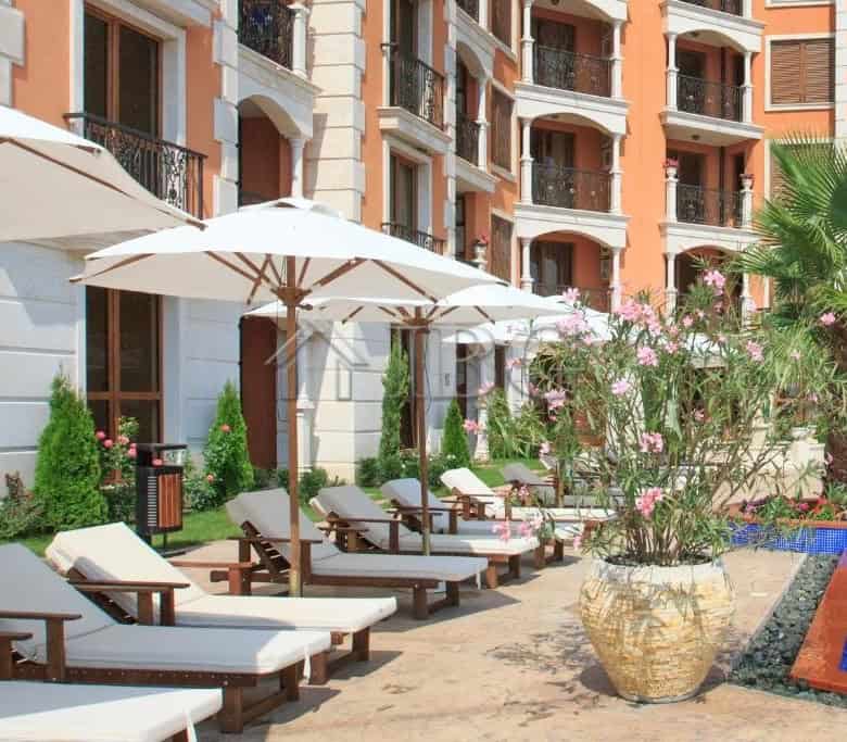 Pool access studio in Cascadas Ravda with outdoor lounging area and garden view.