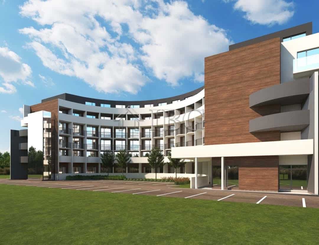 Modern residential building in a resort setting with contemporary architecture and spacious balconie.
