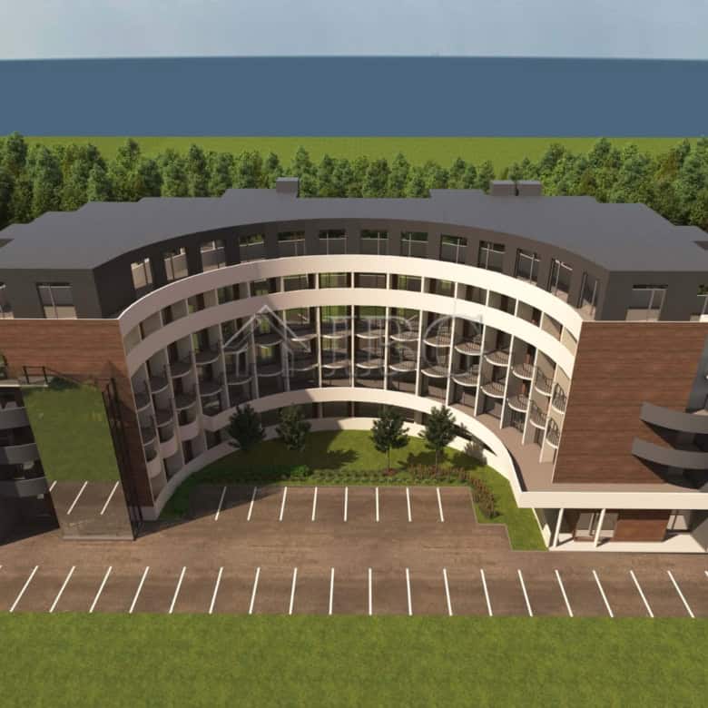 Modern residential building in a resort setting with curved design and multiple balconies.