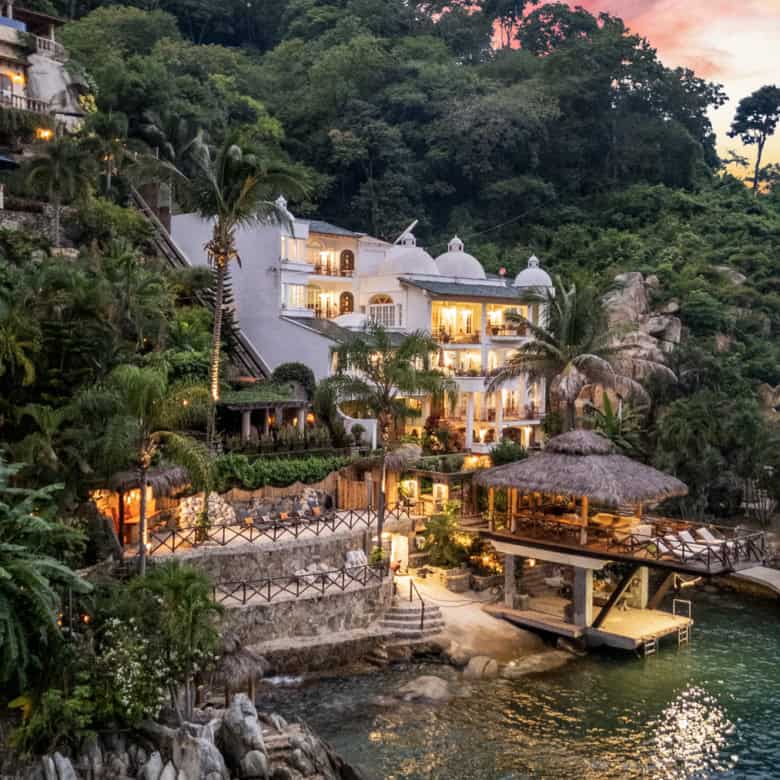Seaside villa featuring stunning ocean views and lush tropical surroundings. Perfect for luxury prop.