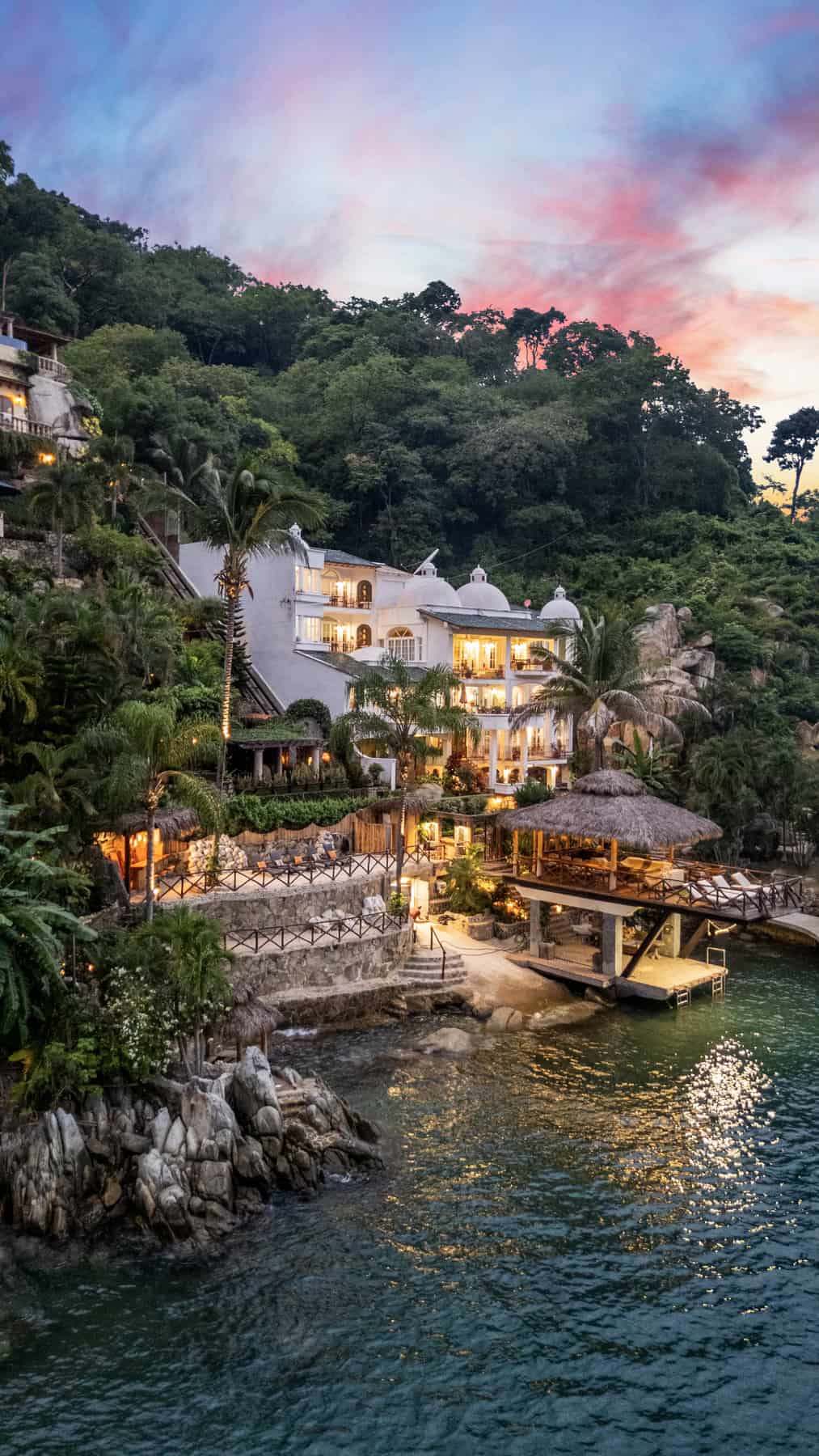 Seaside villa featuring stunning ocean views and lush tropical surroundings. Perfect for luxury prop.