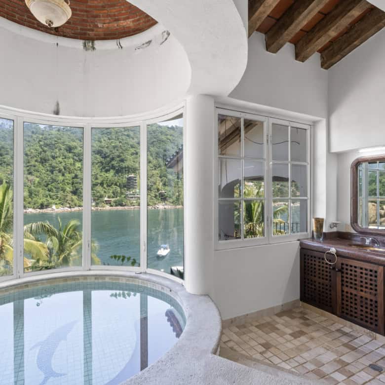 Luxury lakeside villa with pool and panoramic views.
