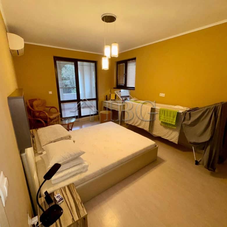 Spacious 2-bedroom apartment in Esteban Complex, Nessebar, with modern furnishings and balcony views.
