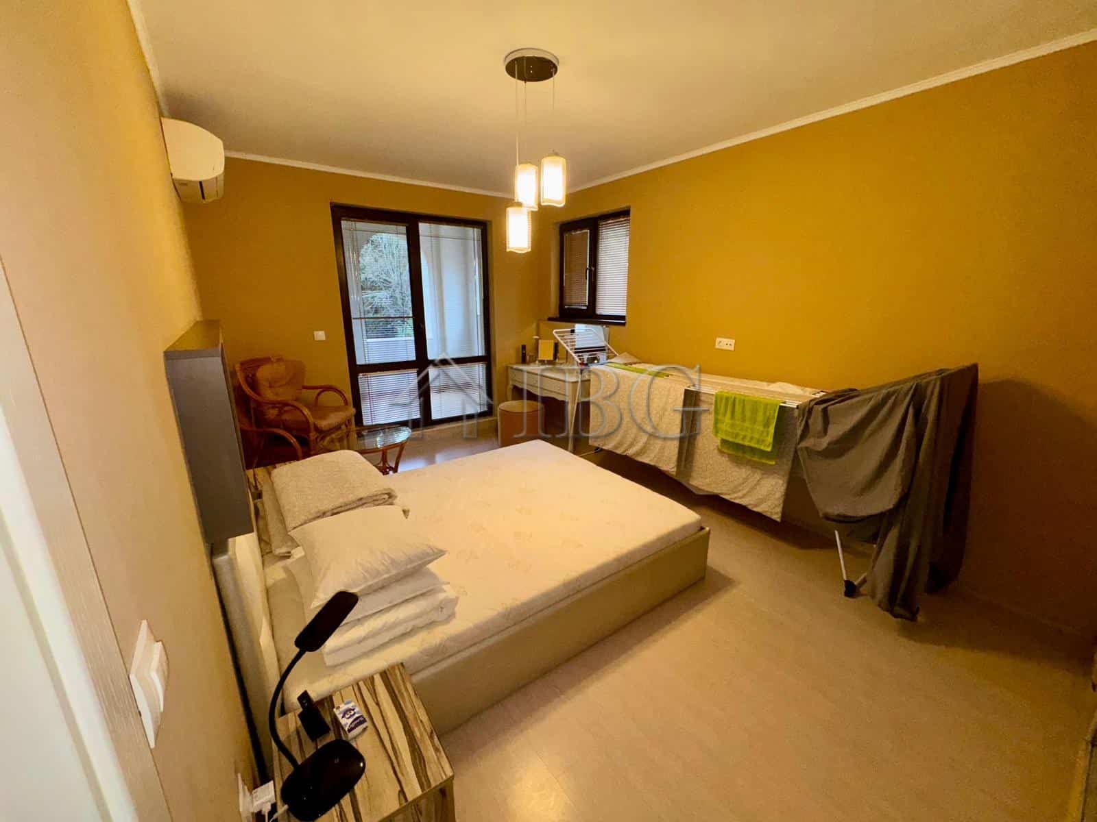 Spacious 2-bedroom apartment in Esteban Complex, Nessebar, with modern furnishings and balcony views.