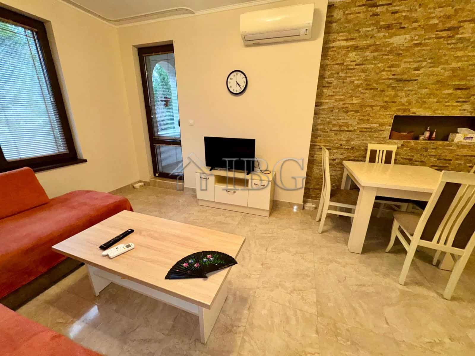 Bright living room with modern furnishings and a cozy sofa.