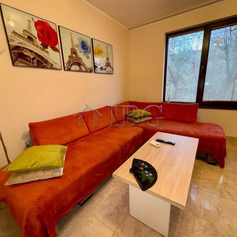 Bright living room with comfortable sofa and artwork.
