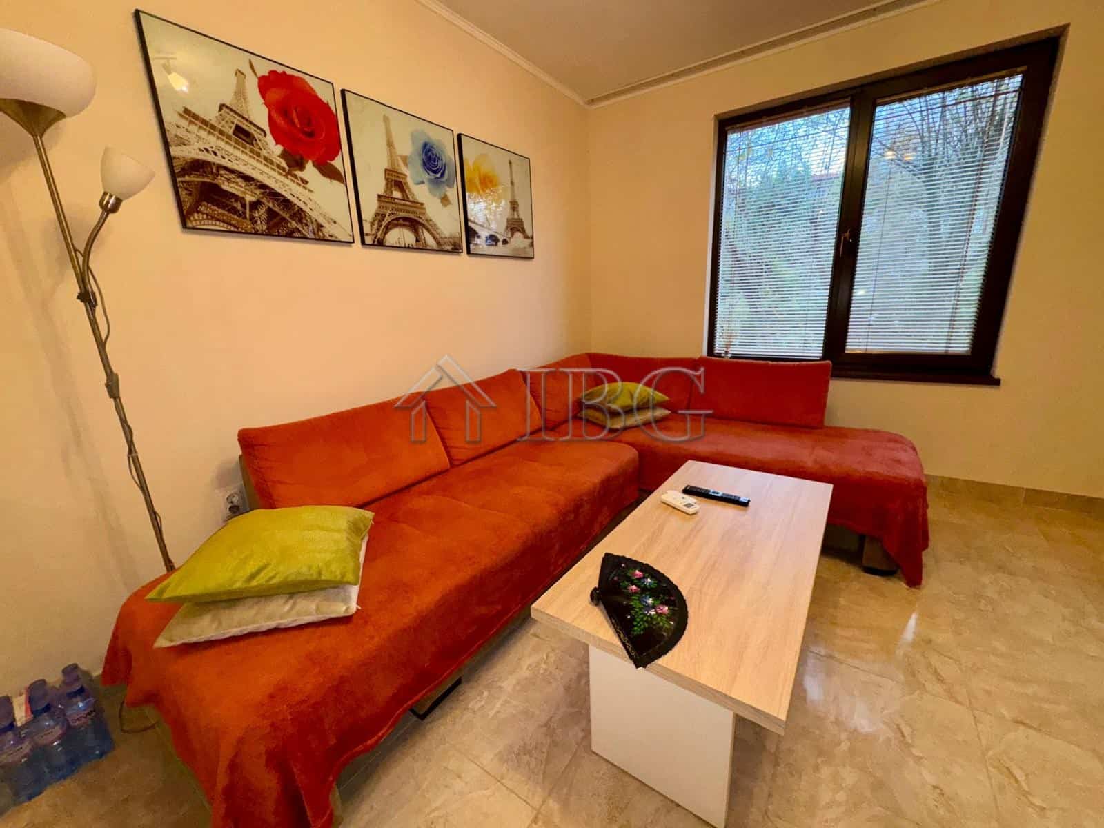 Bright living room with comfortable sofa and artwork.