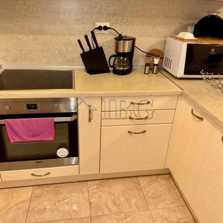 Modern kitchen with appliances and utensils in Esteban Complex.