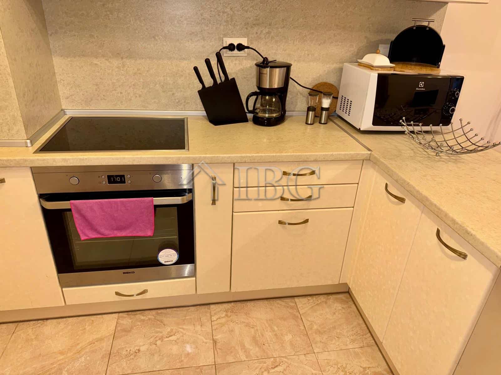 Modern kitchen with appliances and utensils in Esteban Complex.
