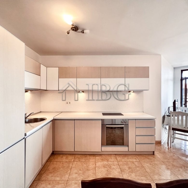 Bright, modern kitchen in a 2-bedroom apartment with sea and pool views.