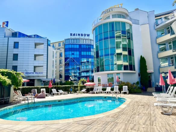 Hotel with outdoor pool and sun loungers in Sunny Beach, Bulgaria.