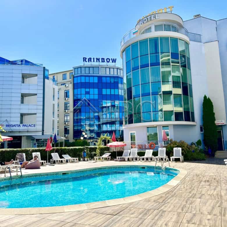 Hotel with outdoor pool and sun loungers in Sunny Beach, Bulgaria.