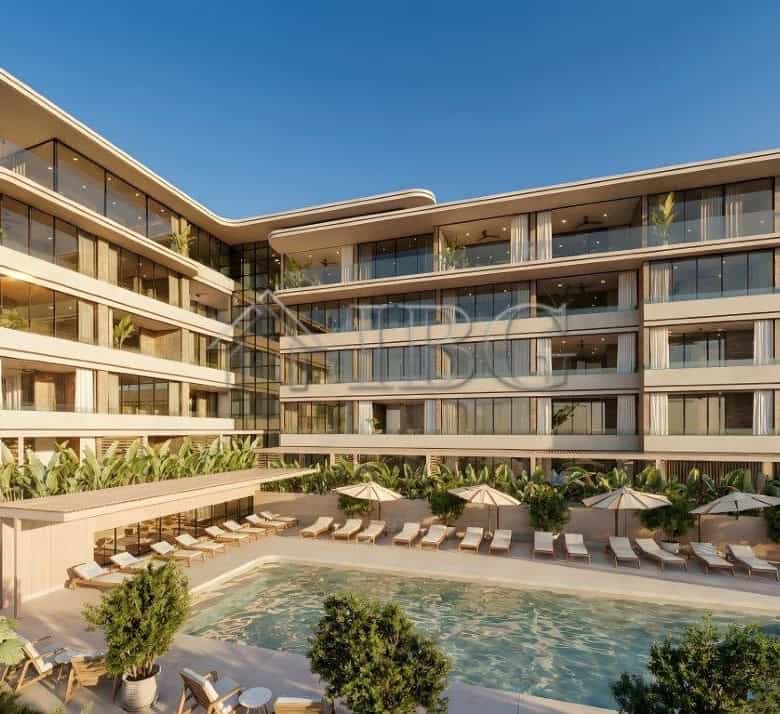 Modern loggia residences near the sea with spacious balconies and lush surroundings.