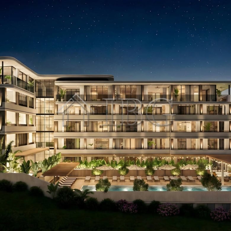 Night view of Loggia Residences with sea and starry sky backdrop in Sunny Beach.