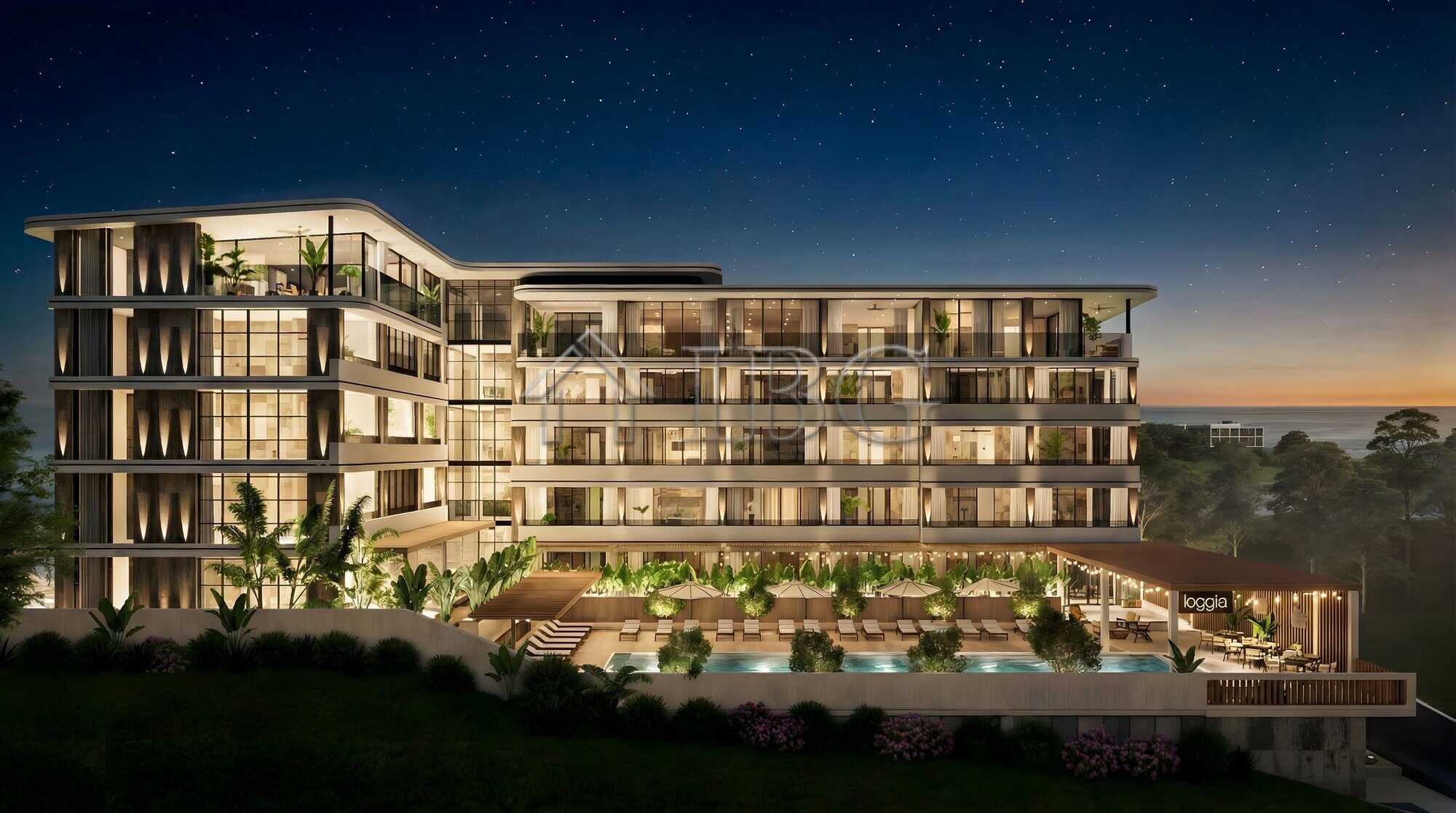 Night view of Loggia Residences with sea and starry sky backdrop in Sunny Beach.