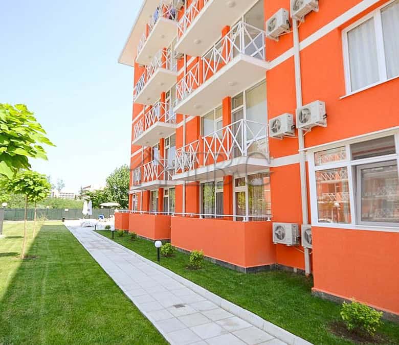 Bright orange two-bedroom duplex apartment with balconies in Sunny Beach.