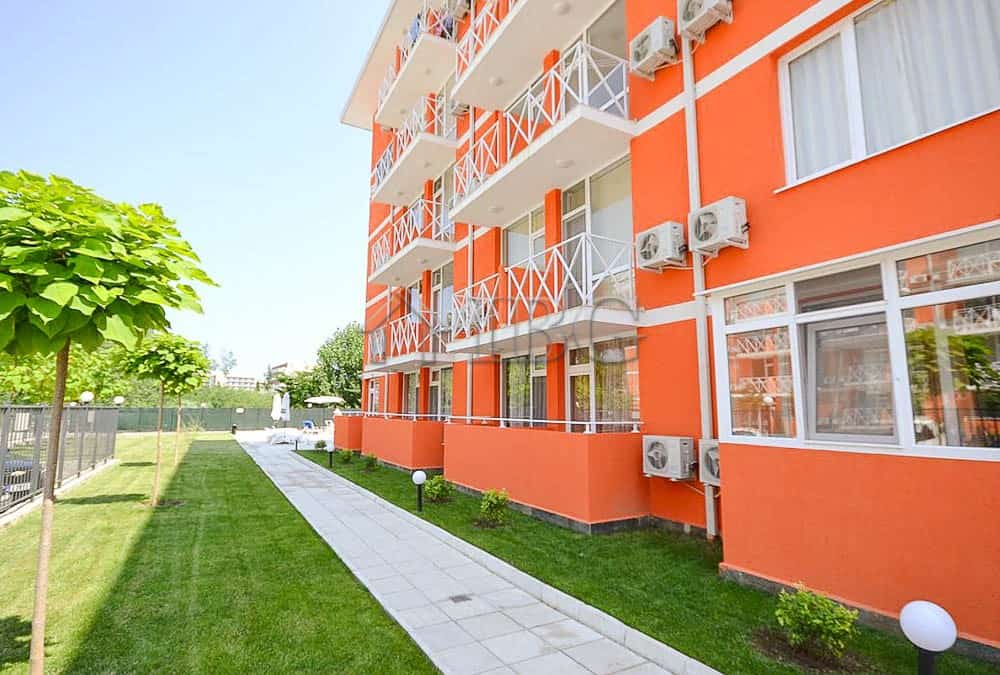 Bright orange two-bedroom duplex apartment with balconies in Sunny Beach.