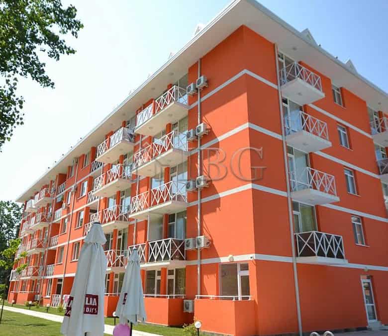 Bright orange duplex apartment with multiple balconies in Sunny Beach.
