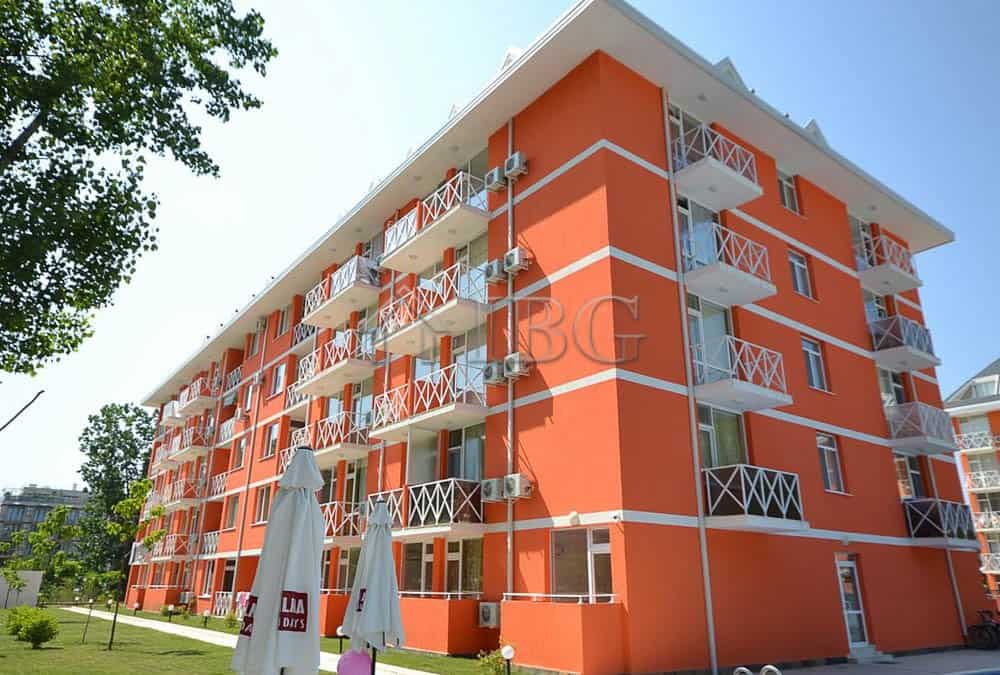 Bright orange duplex apartment with multiple balconies in Sunny Beach.
