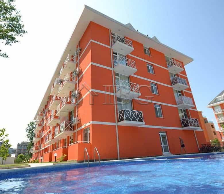 Bright orange duplex apartment with balconies near the pool in Sunny Beach.