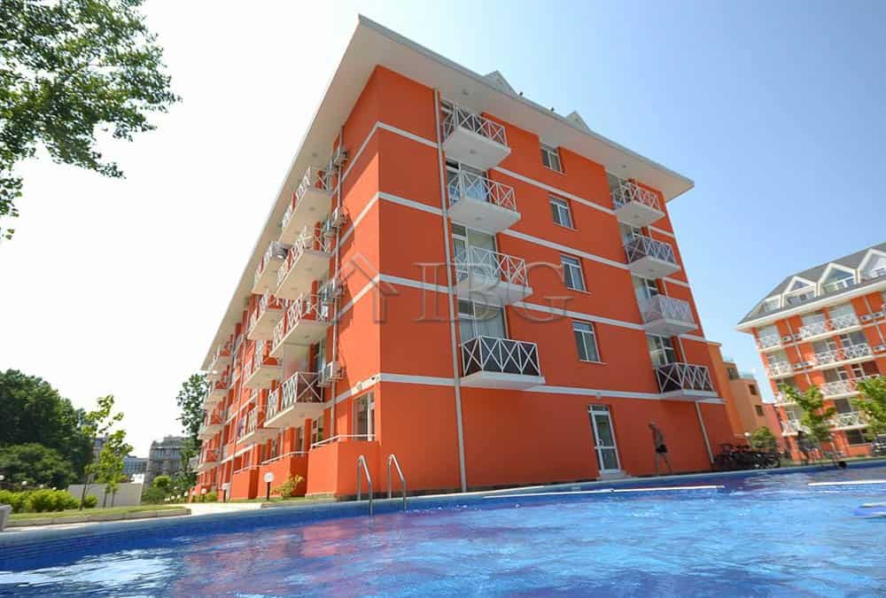 Bright orange duplex apartment with balconies near the pool in Sunny Beach.