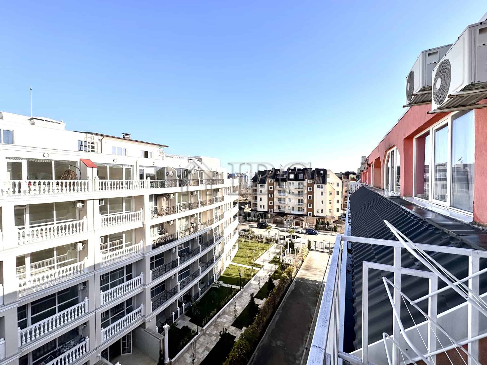 Balcony view from a studio apartment in Gerber 4, Sunny Beach, overlooking neighboring buildings and.