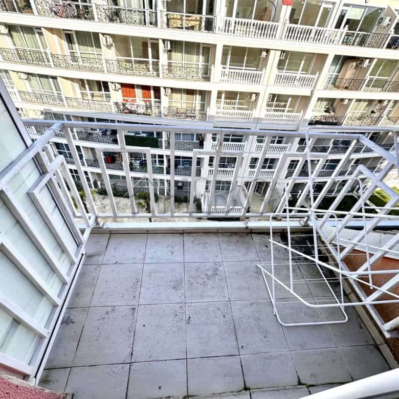 Balcony view of a modern apartment in Gerber 4, Sunny Beach, overlooking neighboring buildings.
