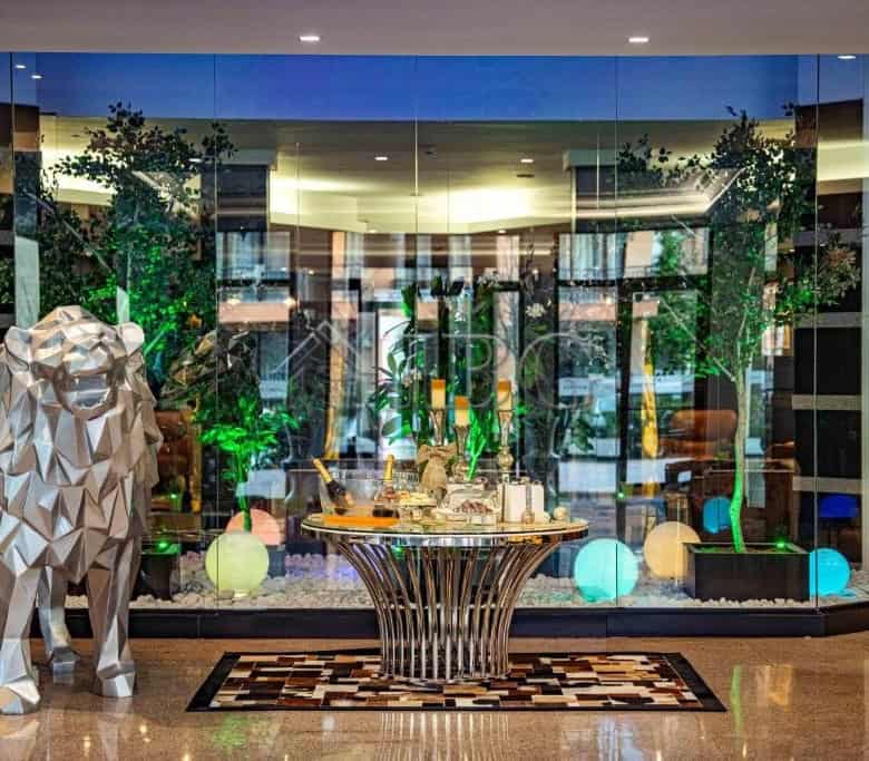 Elegant hotel lobby featuring contemporary design and vibrant lighting accents.