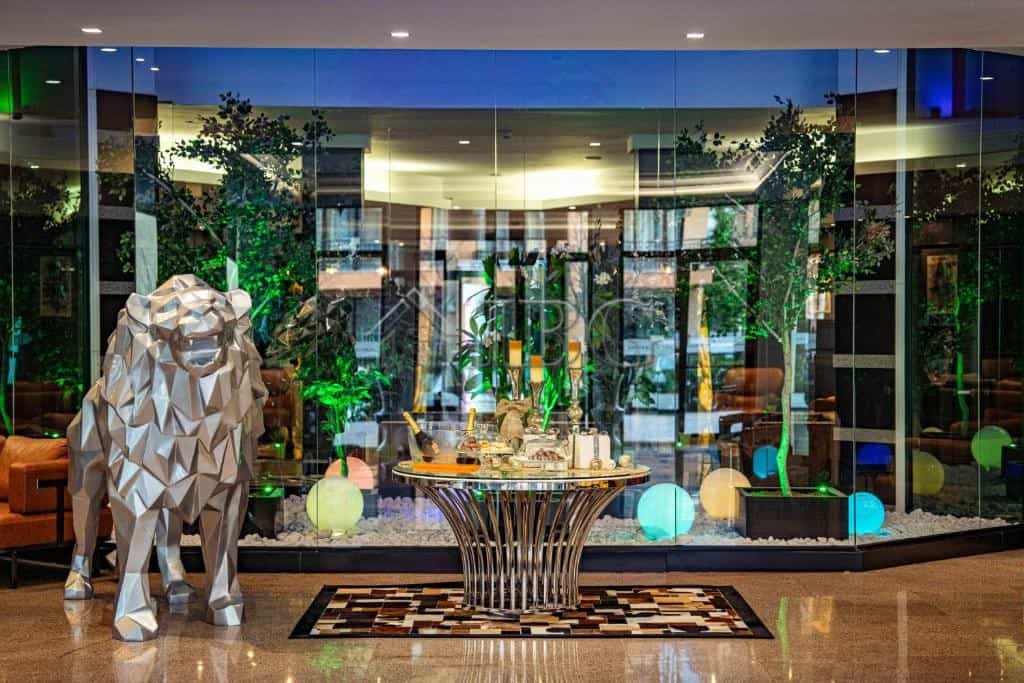 Elegant hotel lobby featuring contemporary design and vibrant lighting accents.