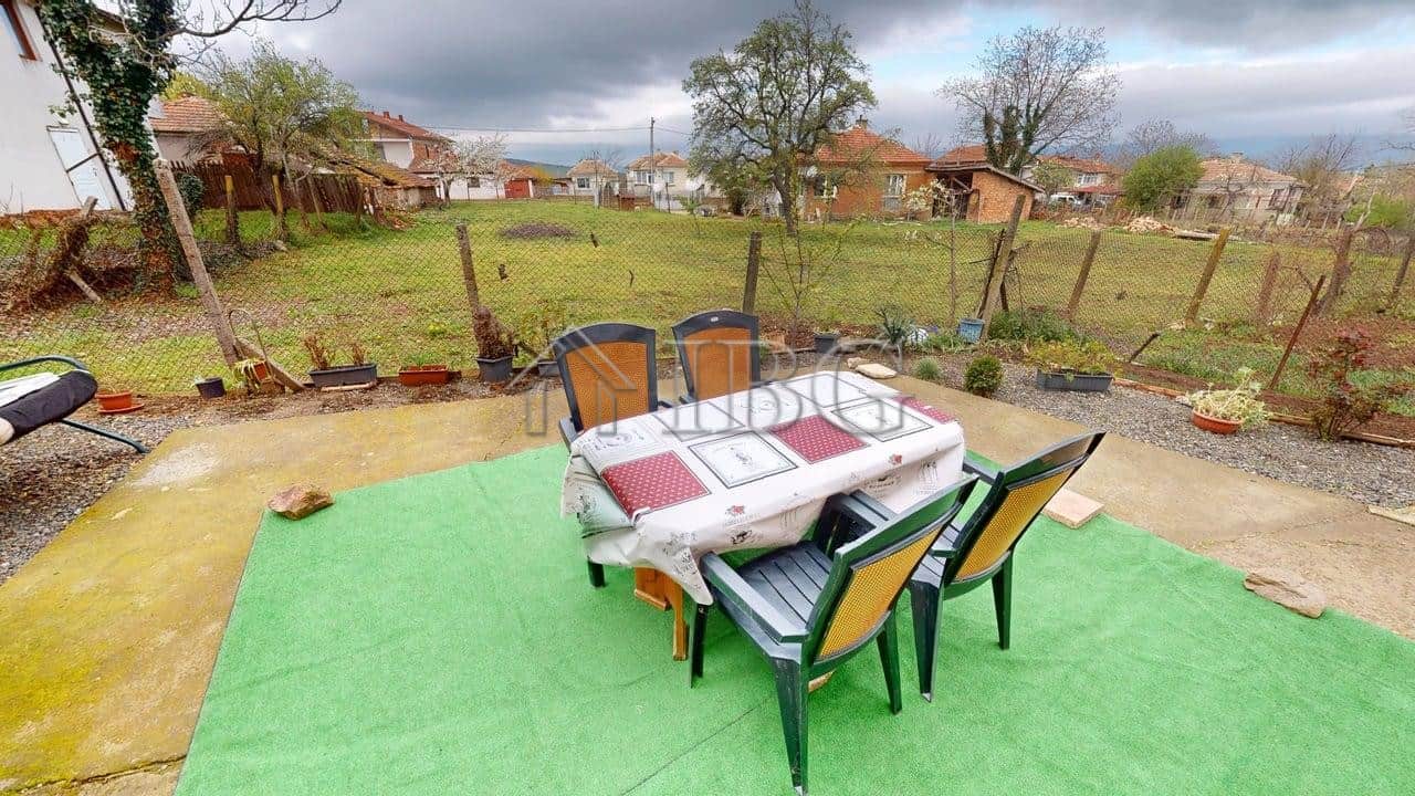 Two-storey house with outdoor patio in a gated community in Poroy Village.