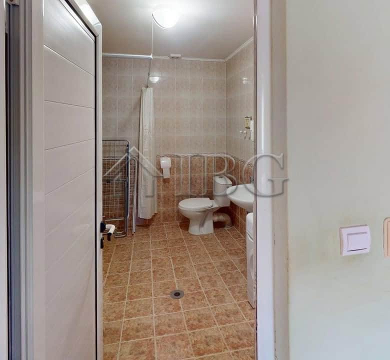 Interior view of a bathroom in a two-storey house located in a gated complex in Poroy Village.