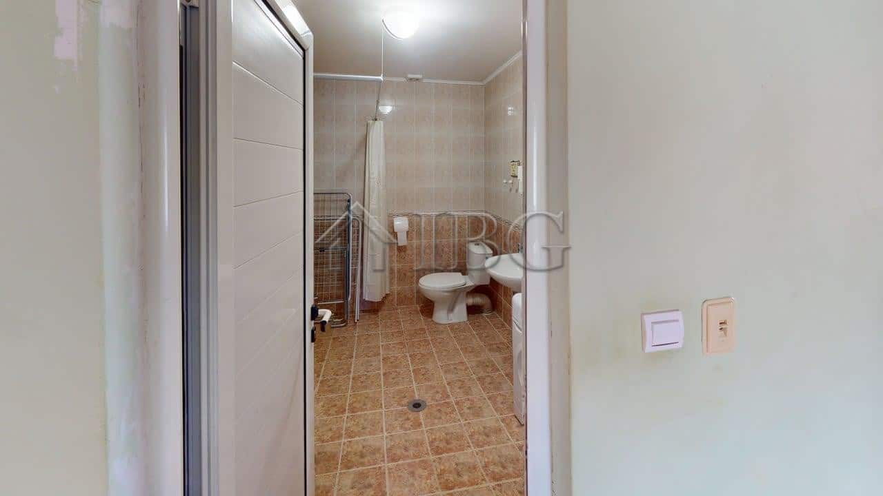 Interior view of a bathroom in a two-storey house located in a gated complex in Poroy Village.