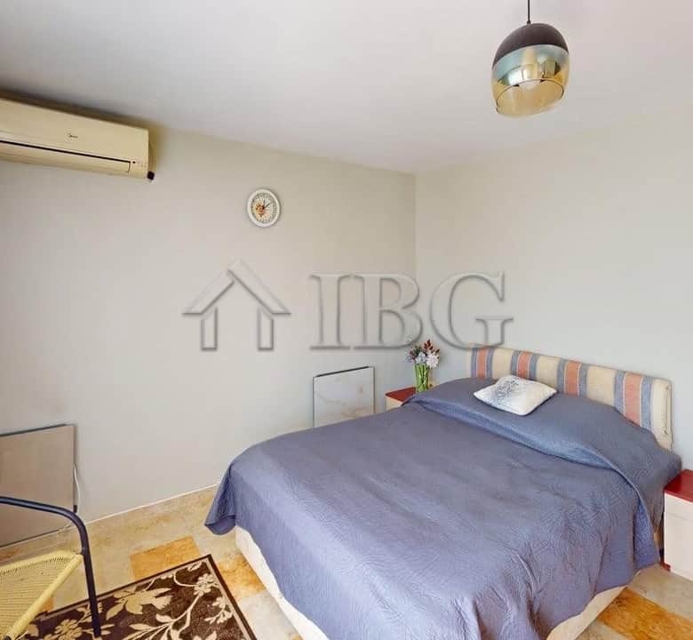Interior of a two-storey house in a gated complex in Poroy Village, featuring a cozy bedroom with mo.