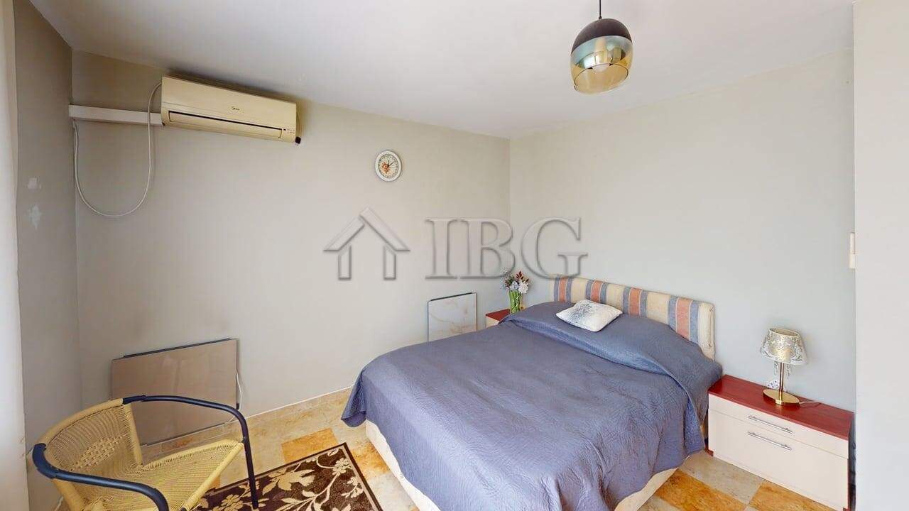 Interior of a two-storey house in a gated complex in Poroy Village, featuring a cozy bedroom with mo.