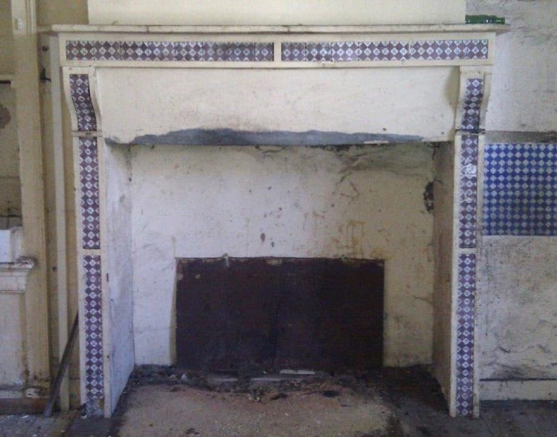 Fireplace undergoing renovation in a historic Oradour Sur Vayres property.