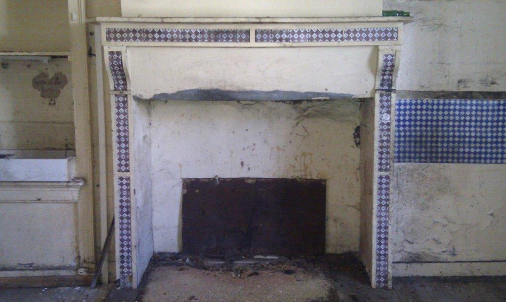 Fireplace undergoing renovation in a historic Oradour Sur Vayres property.