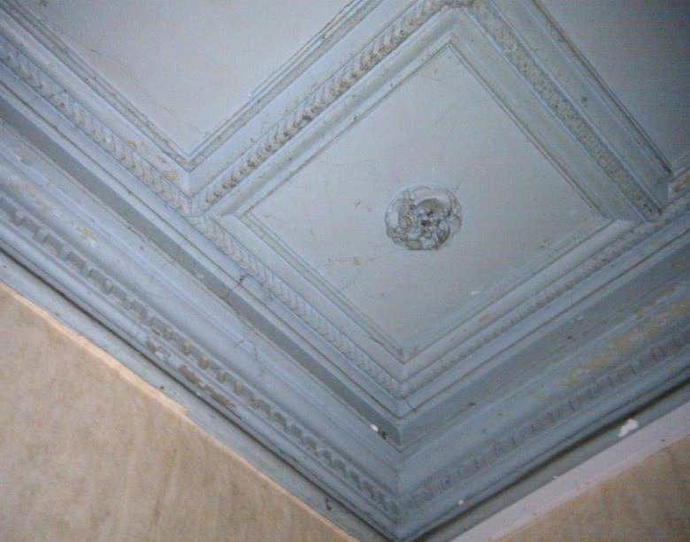 Interior ceiling renovation with ornate moldings in Oradour Sur Vayres, Limousin, France.