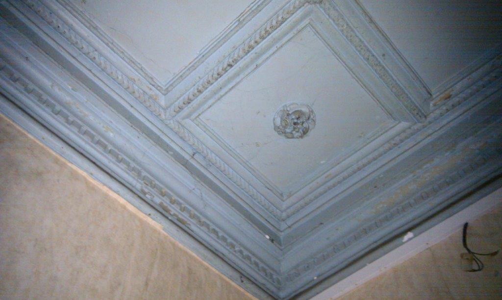 Interior ceiling renovation with ornate moldings in Oradour Sur Vayres, Limousin, France.