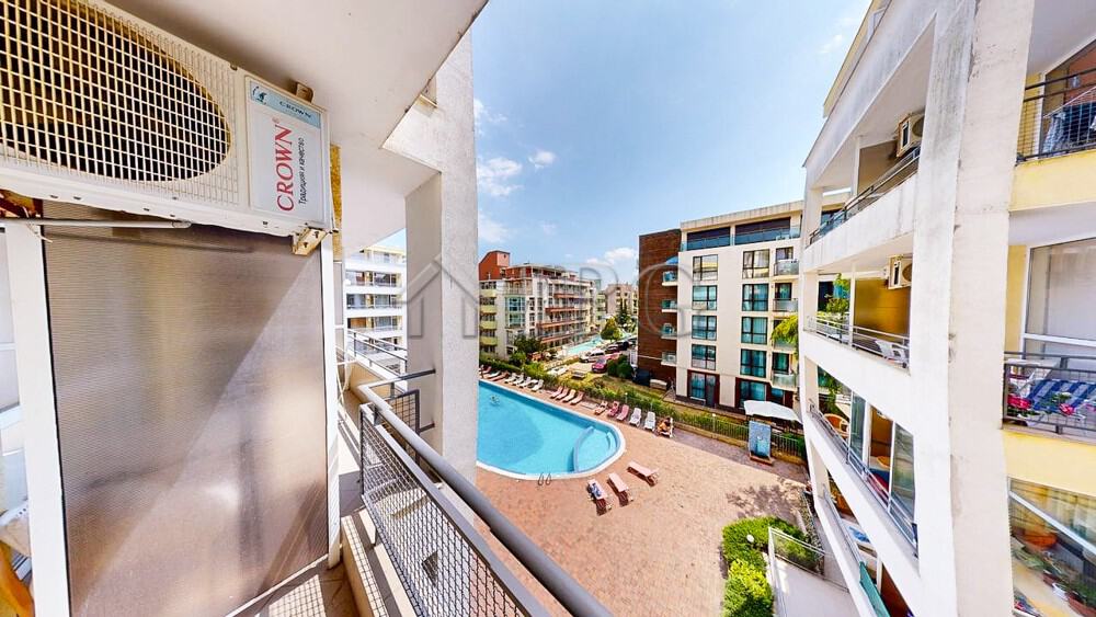 View of Sunset Beach 2 complex with pool and surrounding apartments in Sunny Beach.