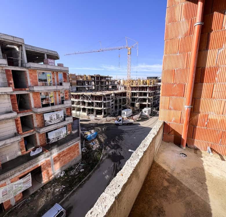 Construction site with ongoing building work for new residential apartments.