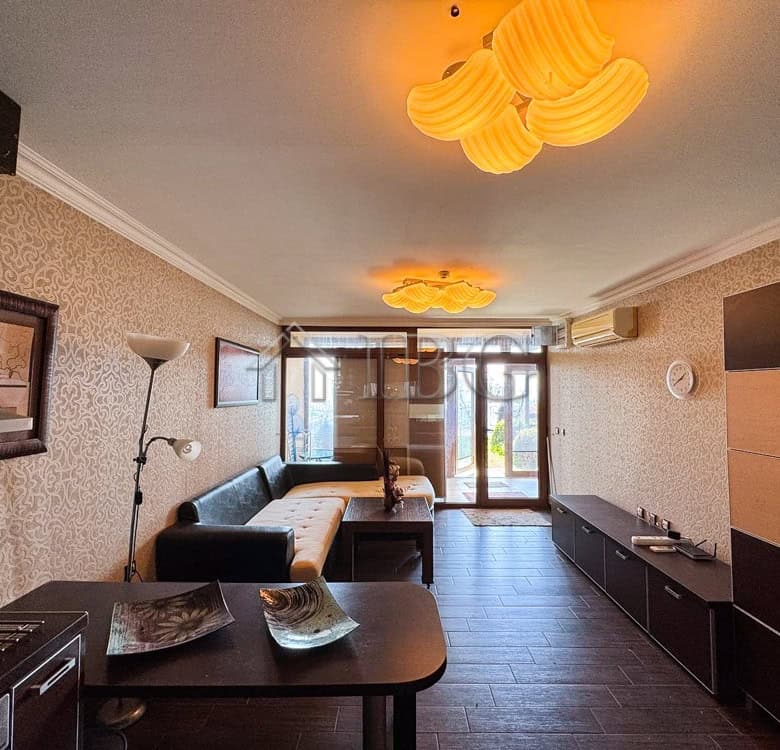 Spacious living room with sea views, modern furnishings, and balcony access in Sveti Vlas.