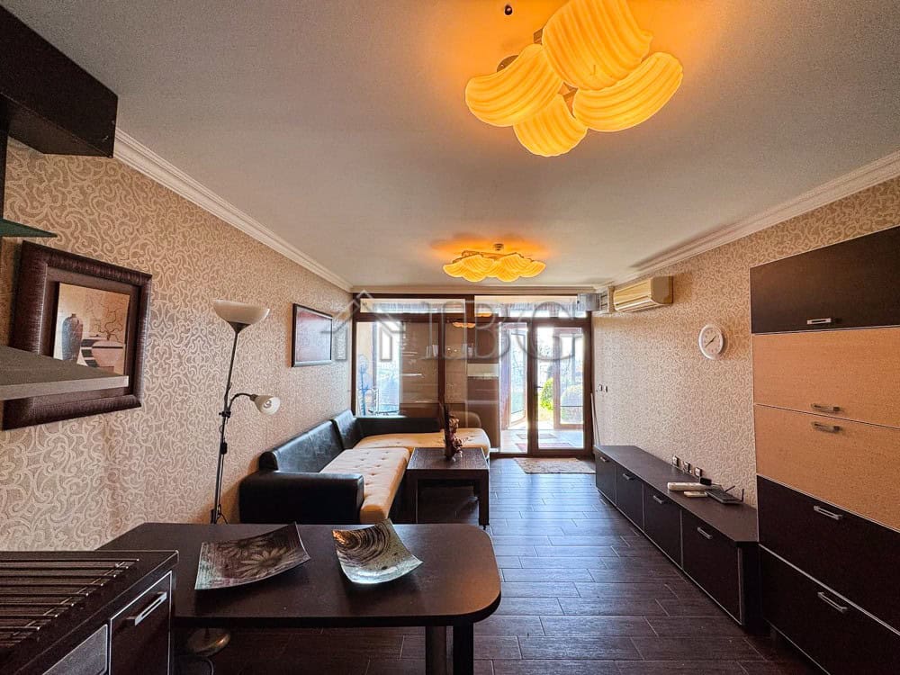 Spacious living room with sea views, modern furnishings, and balcony access in Sveti Vlas.