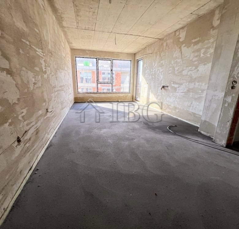 Spacious unfinished 1-bedroom apartment with large window views in Pomorie's new residential buildin.
