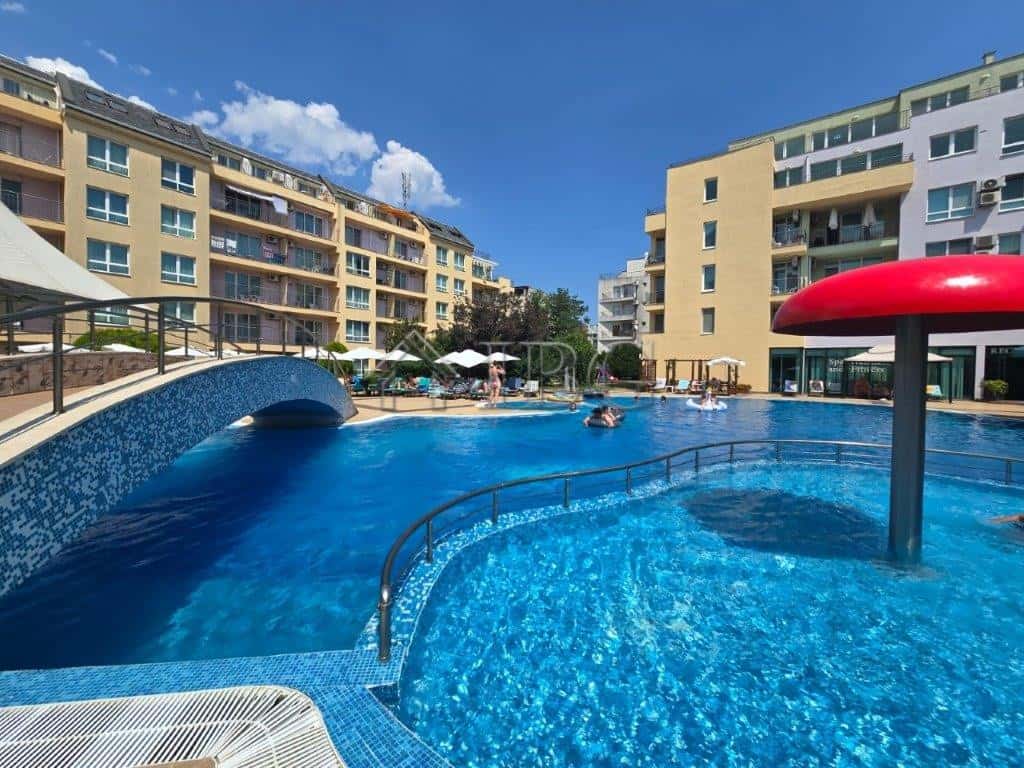 Modern pool view at Pollo Resort, Sunny Beach Pool view of a 2-room apartment at Pollo Resort, Sunny Beach, with a large swimming pool and surroun.