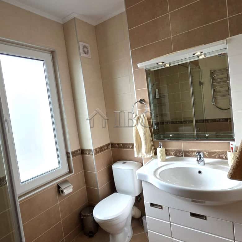Bright bathroom with modern fixtures and natural light.