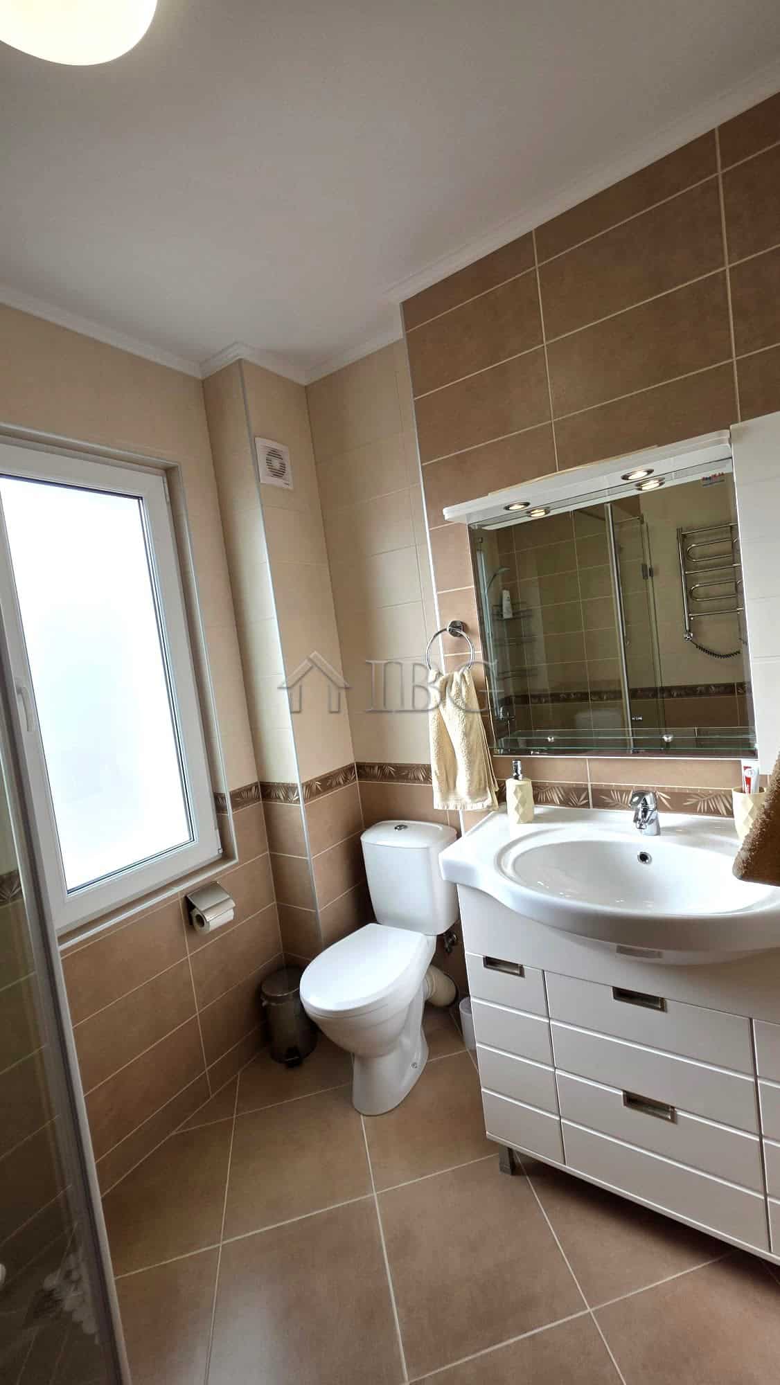 Bright bathroom with modern fixtures and natural light.